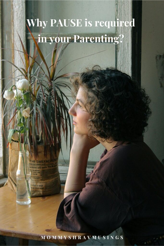 Parent and child sitting quietly together at home, reflecting a calm and gentle parenting moment
